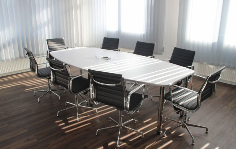 /Conference table with empty chairs.png